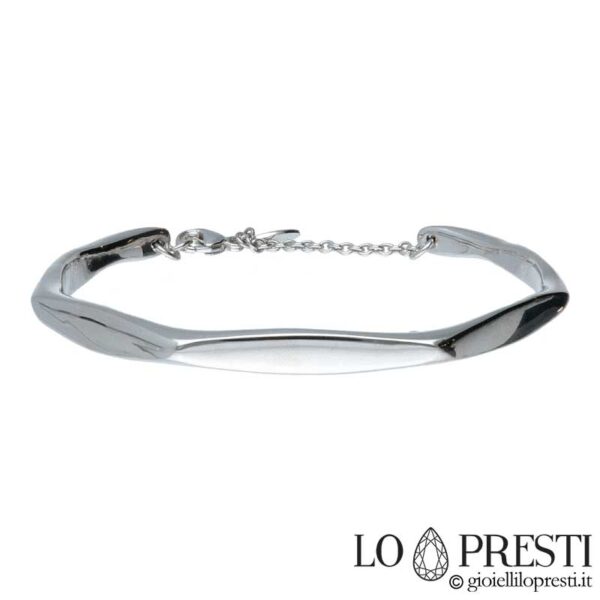 Bracciale rigido in oro bianco 18kt lavorazione lucida con apertura sotto.Certificato di garanzia e confezione regalo.